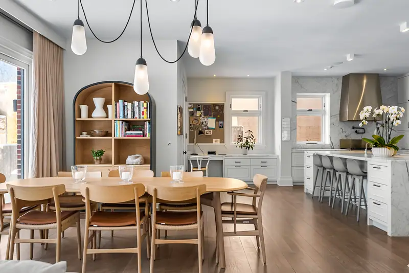 Family dining area with arched bookcase