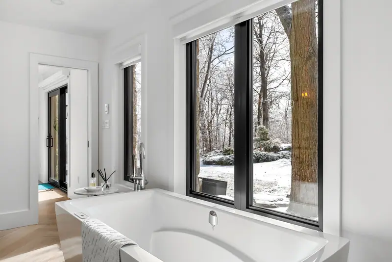 Soaking tub with forest views