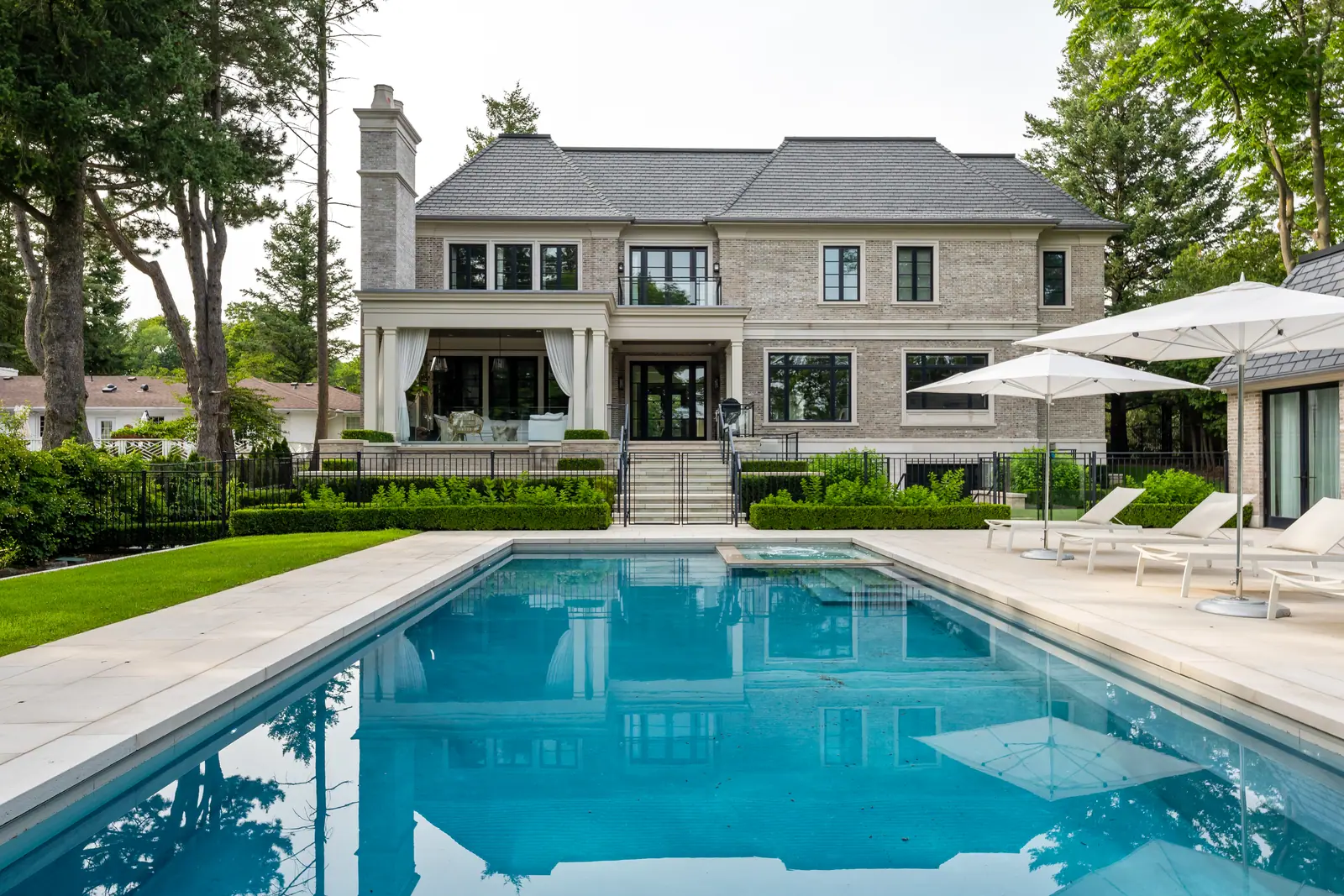Rear elevation over the pool and limestone terrace