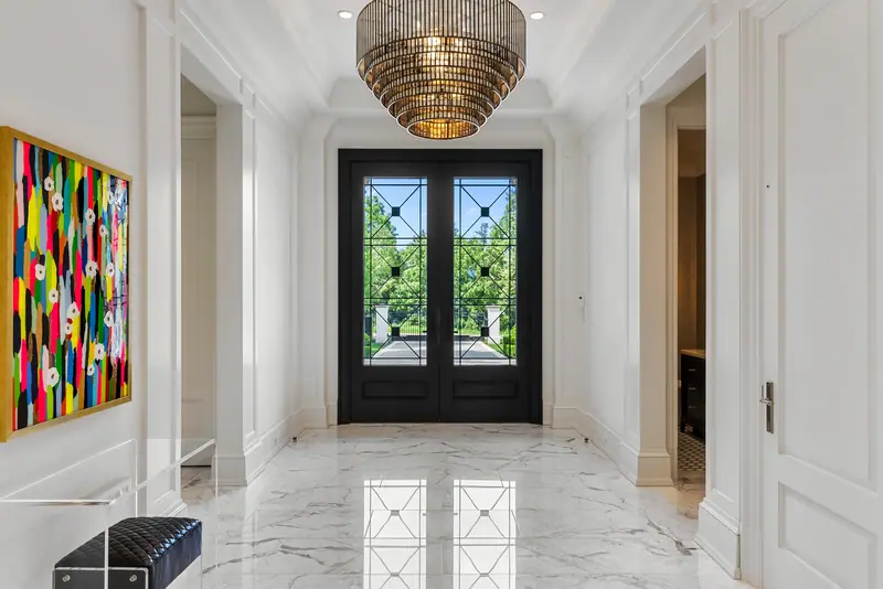 Marble foyer with steel-and-glass front doors
