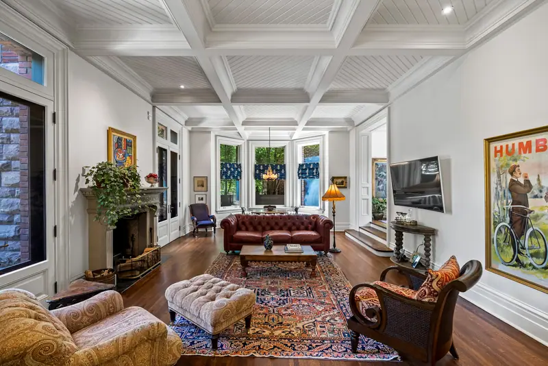 Coffered family room with fireplace and French doors to the garden
