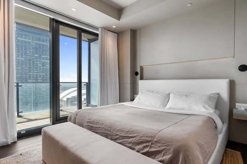 Bedroom with balcony and skyline