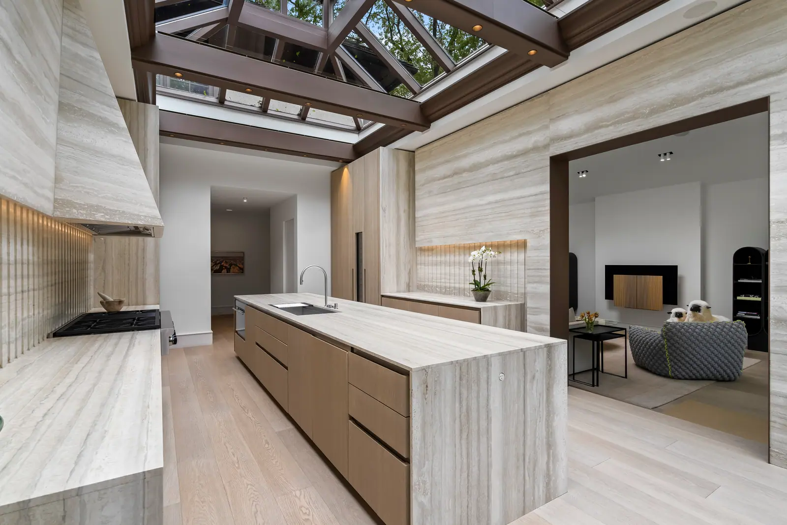 Kitchen island and fireplace beyond