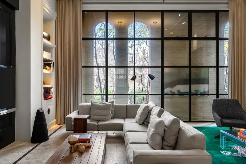 Family room with steel-framed arched windows