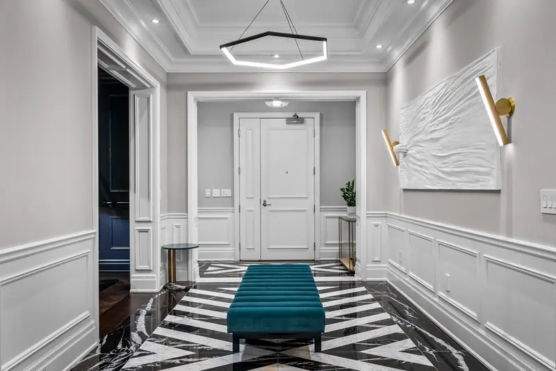 Gallery hall with chevron marble floor