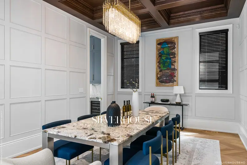 Dining room with wood ceiling and stone table