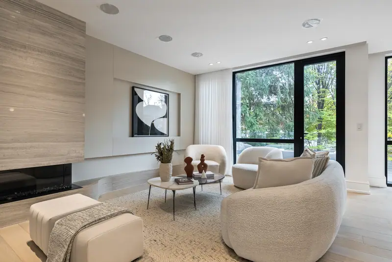 Living room with travertine fireplace wall