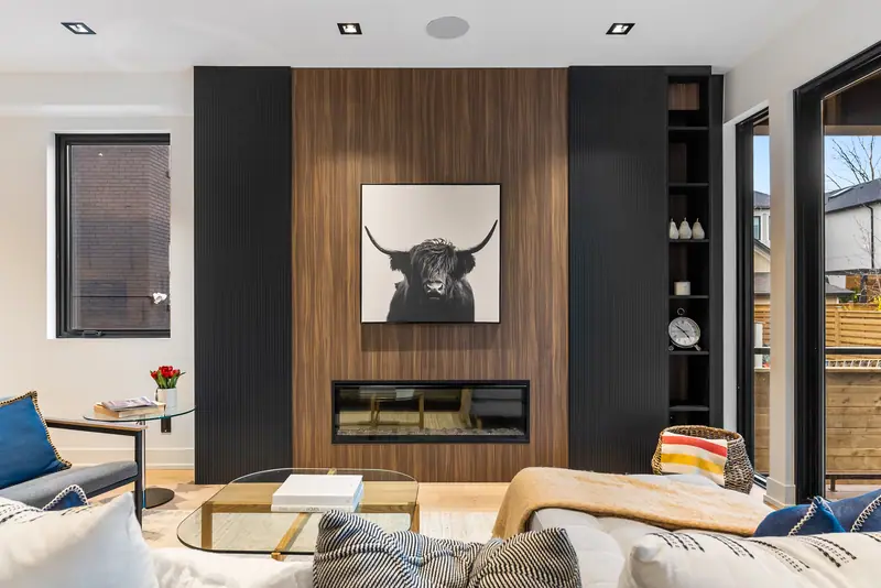 Walnut fireplace wall with highland cow art
