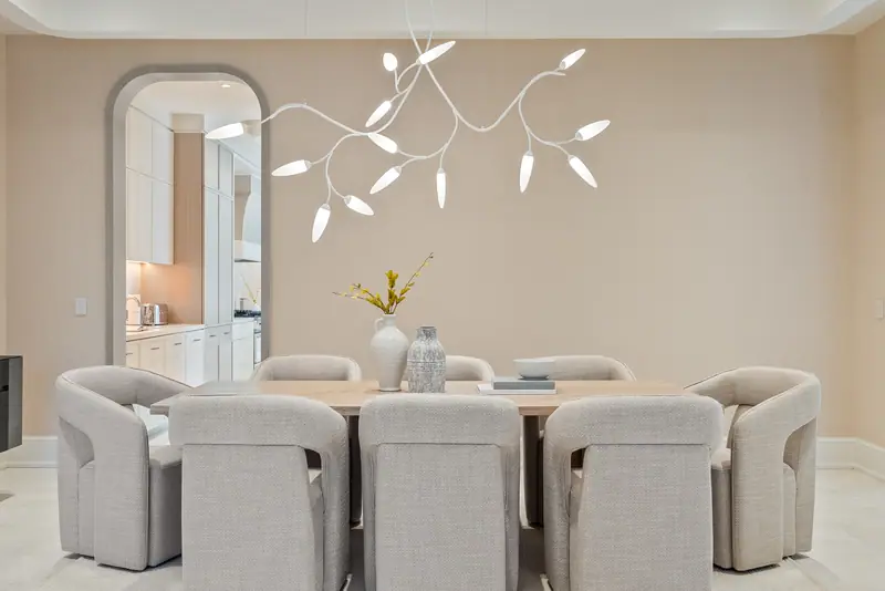 Dining room with branch chandelier and arched doorway